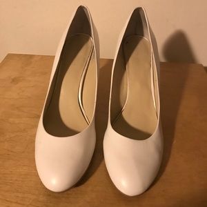White leather pumps